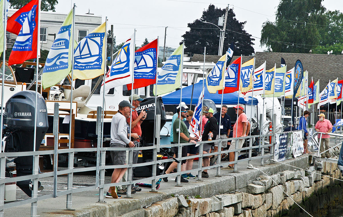 Visitors walking along the Maine Boat and Home Show docks