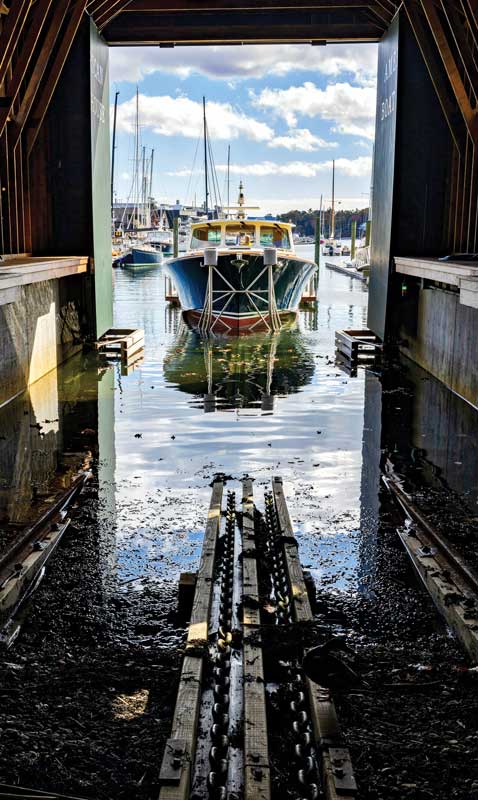 The boat cradle and car that holds it are moved by a continuous chain loop system
connected to an electric capstan winch.